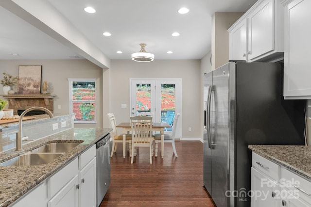 1919 Madeira Cir, Waxhaw, NC 28173 - kitchen with a sink, stainless steel appliances, dark wood-style flooring, recessed lighting, and white cabinetry