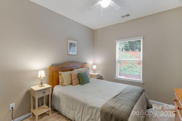 1919 Madeira Cir, Waxhaw, NC 28173 - bedroom featuring light carpet, baseboards, and a ceiling fan