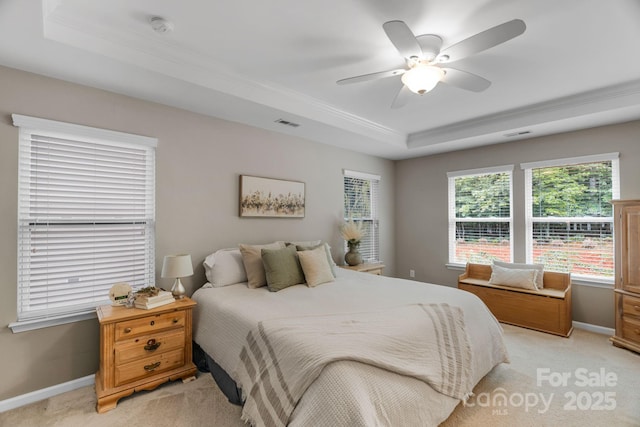 1919 Madeira Cir, Waxhaw, NC 28173 - bedroom featuring a tray ceiling, light colored carpet, crown molding, baseboards, and a ceiling fan