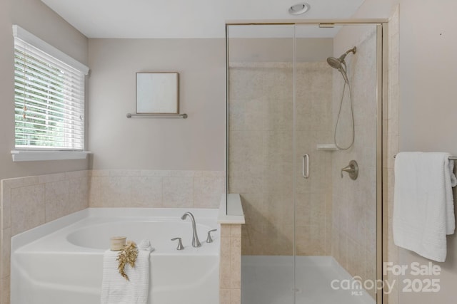 1919 Madeira Cir, Waxhaw, NC 28173 - full bathroom featuring a garden tub and a shower stall