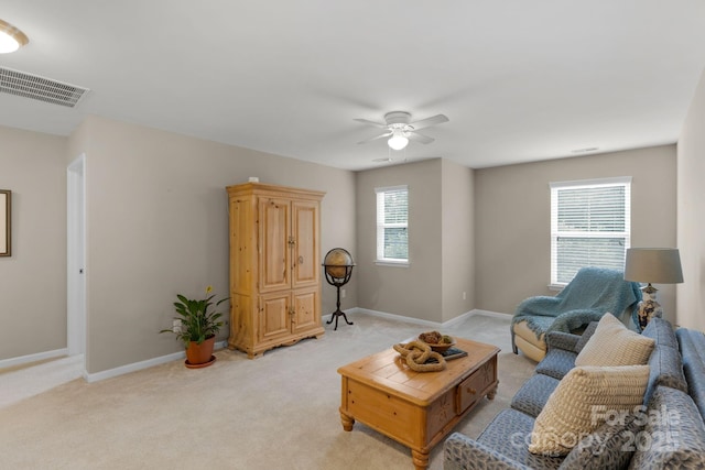 1919 Madeira Cir, Waxhaw, NC 28173 - living room featuring ceiling fan, baseboards, and light colored carpet