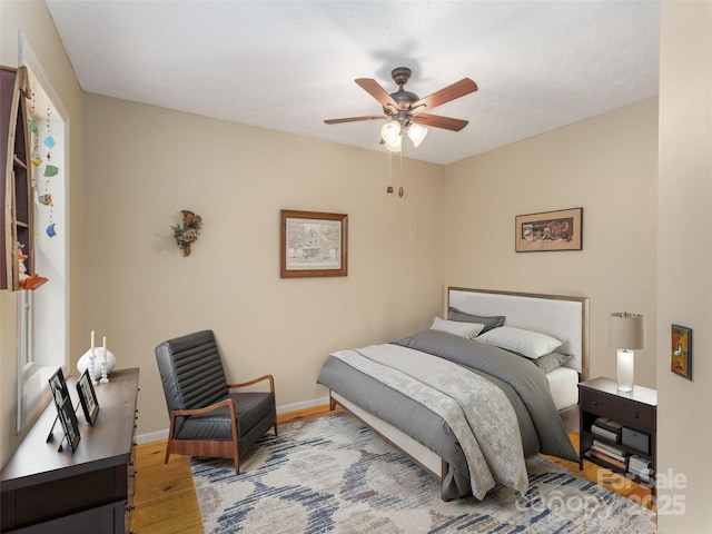 41 Trapper Ln, Waynesville, NC 28785 - bedroom with light wood-style flooring, baseboards, and a ceiling fan