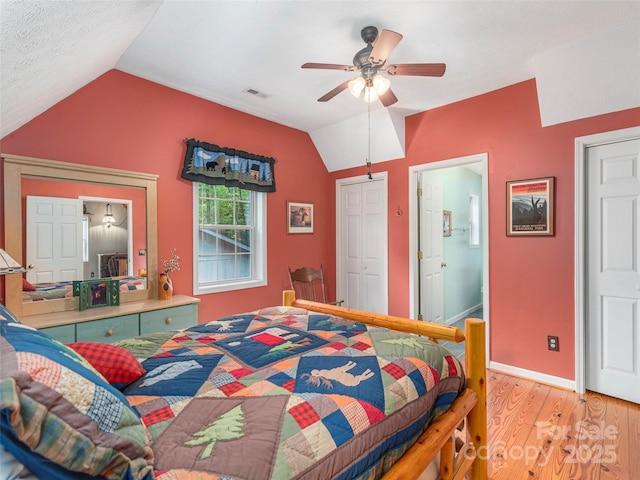 41 Trapper Ln, Waynesville, NC 28785 - bedroom with vaulted ceiling, light wood finished floors, ceiling fan, ensuite bath, and baseboards