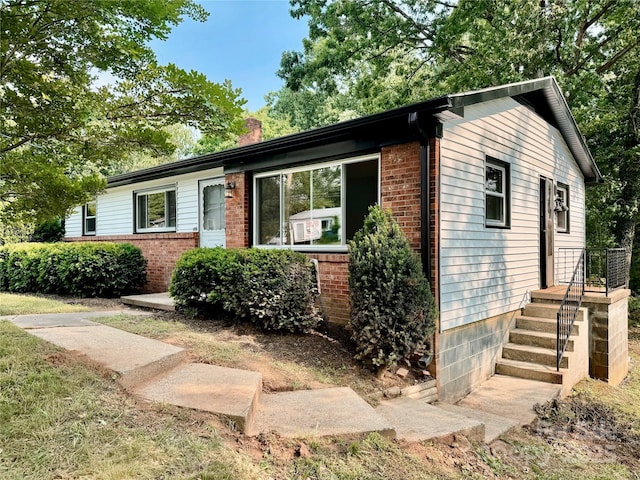 188 Johnston Blvd, Asheville, NC 28806 - ranch-style house featuring a chimney and brick siding