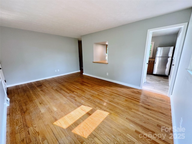 188 Johnston Blvd, Asheville, NC 28806 - spare room featuring light wood finished floors and baseboards
