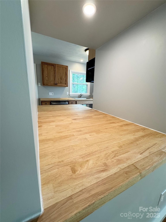 188 Johnston Blvd, Asheville, NC 28806 - kitchen featuring a sink, butcher block countertops, and dishwashing machine