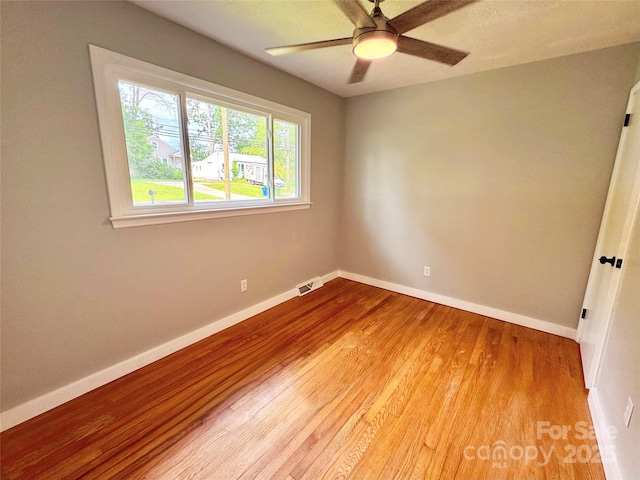 188 Johnston Blvd, Asheville, NC 28806 - empty room featuring light wood finished floors, baseboards, and a ceiling fan