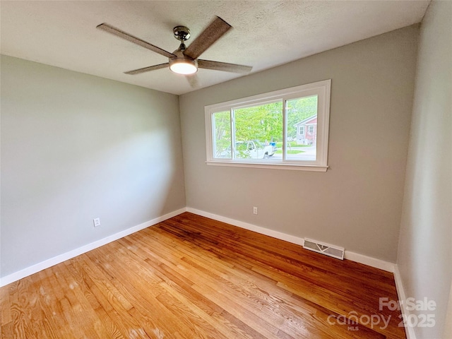 188 Johnston Blvd, Asheville, NC 28806 - unfurnished room with ceiling fan, baseboards, and light wood-style flooring