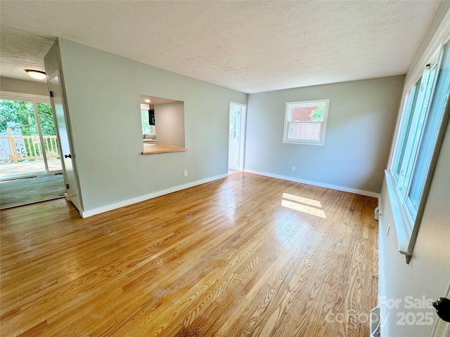 188 Johnston Blvd, Asheville, NC 28806 - empty room featuring a textured ceiling, wood finished floors, and baseboards