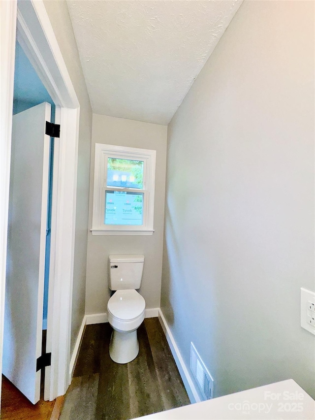 188 Johnston Blvd, Asheville, NC 28806 - bathroom featuring toilet, wood finished floors, baseboards, and a textured ceiling