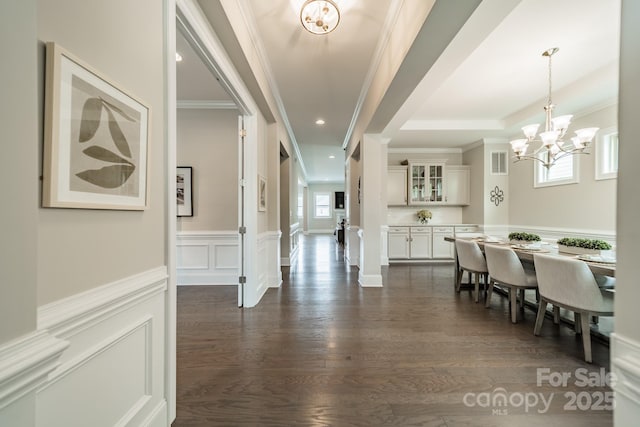 515 Lizzie Ln, Fort Mill, SC 29708 - dining room with a chandelier, ornamental molding, healthy amount of natural light, dark wood finished floors, and wainscoting