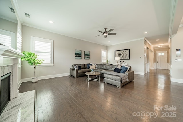 515 Lizzie Ln, Fort Mill, SC 29708 - living room featuring ceiling fan, a fireplace, wood finished floors, crown molding, and baseboards