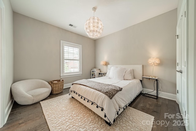 515 Lizzie Ln, Fort Mill, SC 29708 - bedroom featuring dark wood finished floors, baseboards, and a chandelier