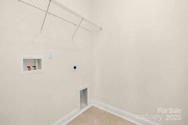 washroom featuring baseboards, hookup for an electric dryer, washer hookup, and light tile patterned floors