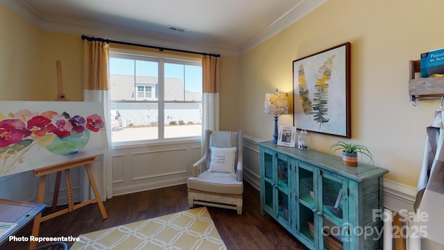 106 Noah Ln, Troutman, NC 28166 - living area featuring ornamental molding, a wainscoted wall, and wood finished floors