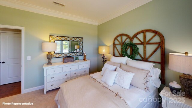 106 Noah Ln, Troutman, NC 28166 - bedroom with ornamental molding, baseboards, and carpet floors