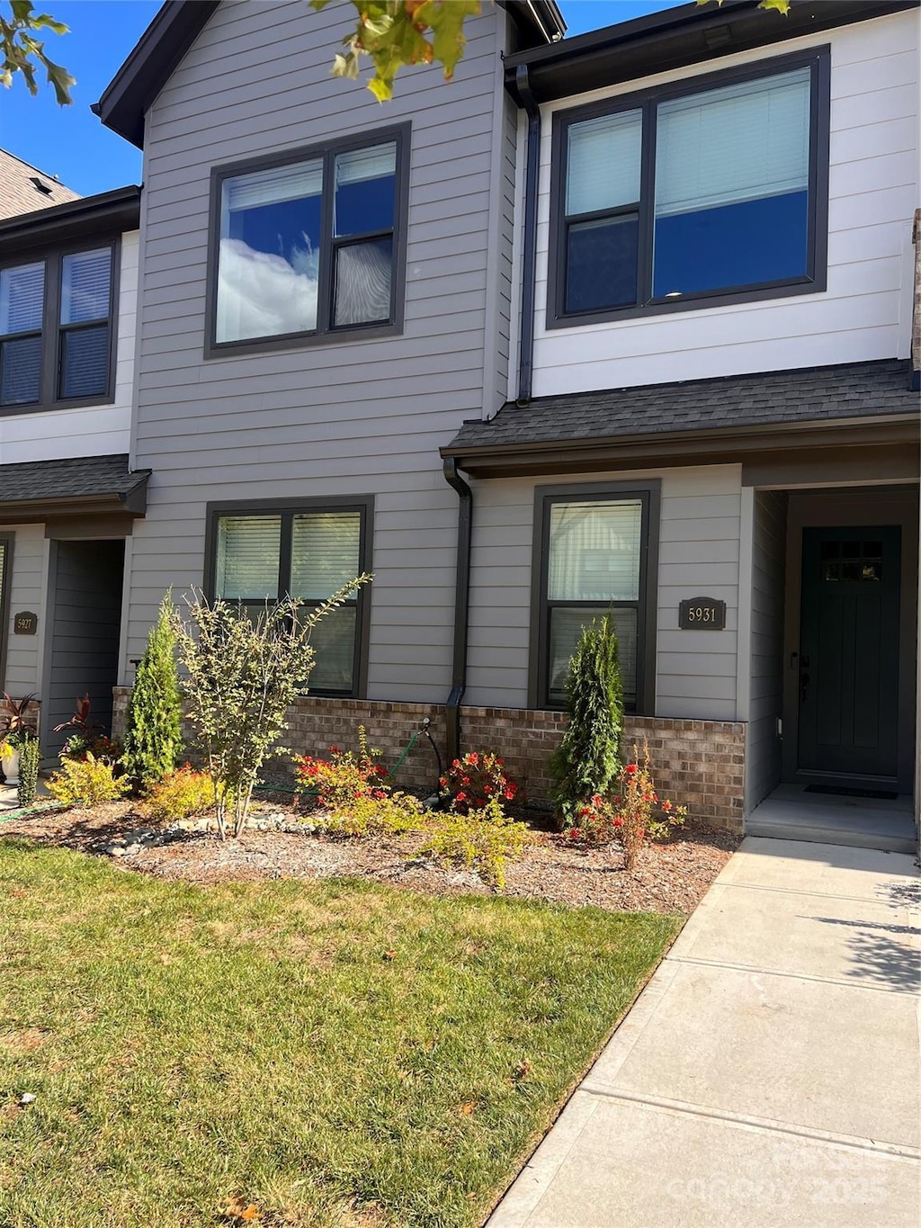 5931 Ardrey Kell Rd, Charlotte, NC 28277 - townhome / multi-family property with brick siding and a front yard