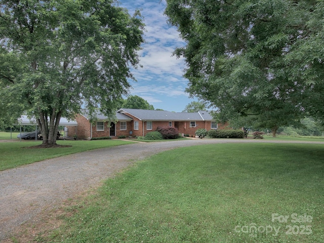 269 Johnson Dairy Rd, Mooresville, NC 28115 - ranch-style house featuring brick siding, a front yard, and curved driveway