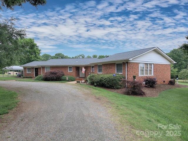 269 Johnson Dairy Rd, Mooresville, NC 28115 - single story home with brick siding, gravel driveway, and a front yard