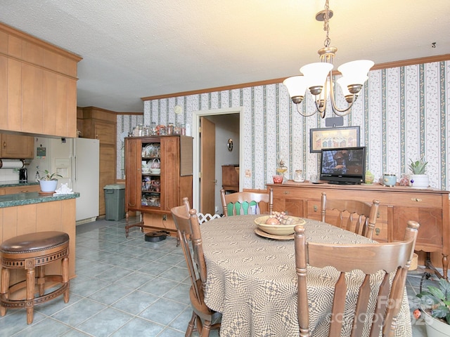 269 Johnson Dairy Rd, Mooresville, NC 28115 - dining area with wallpapered walls, a chandelier, crown molding, light tile patterned floors, and a textured ceiling