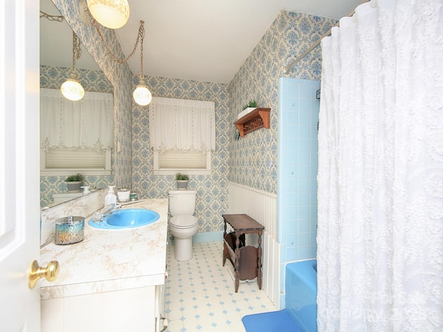 269 Johnson Dairy Rd, Mooresville, NC 28115 - full bath with vanity, toilet, wallpapered walls, tile patterned floors, and shower / bath combo