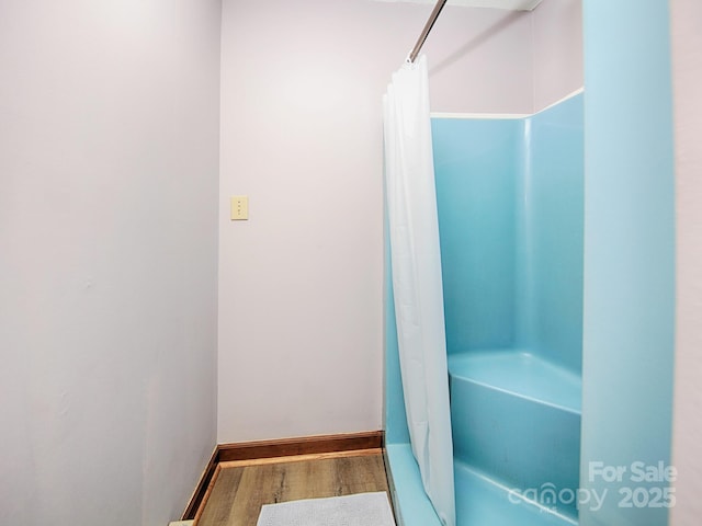 269 Johnson Dairy Rd, Mooresville, NC 28115 - full bathroom with wood finished floors, shower / tub combo, and baseboards