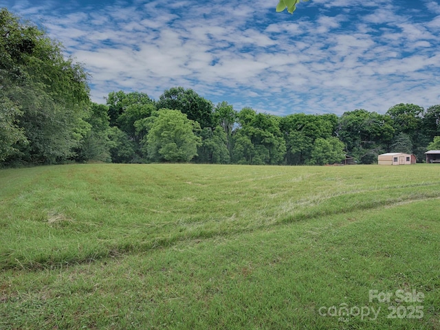 269 Johnson Dairy Rd, Mooresville, NC 28115 - view of grassy yard featuring a rural view and a forest view