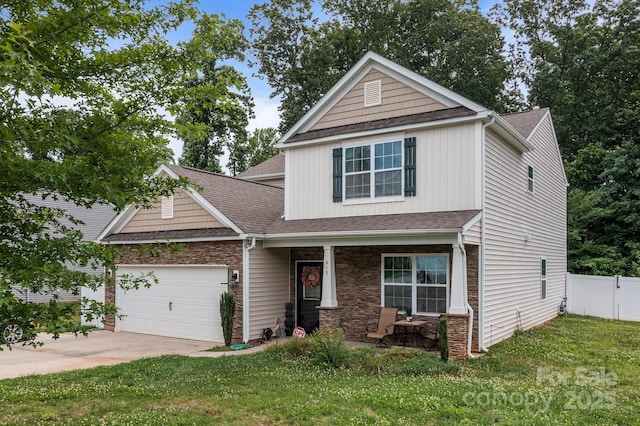 413 Wheat Field Dr, Mount Holly, NC 28120 - view of front of home featuring covered porch, a garage, roof with shingles, and concrete driveway