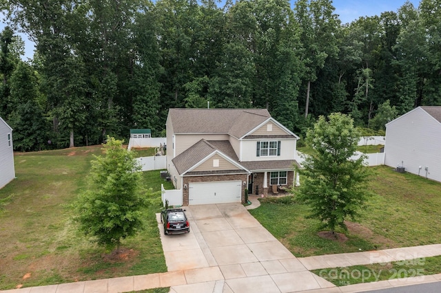 413 Wheat Field Dr, Mount Holly, NC 28120 - view of front of house with concrete driveway, an attached garage, brick siding, and roof with shingles