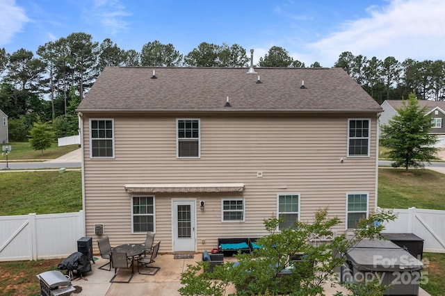 413 Wheat Field Dr, Mount Holly, NC 28120 - back of property featuring a patio, a fenced backyard, a gate, and roof with shingles
