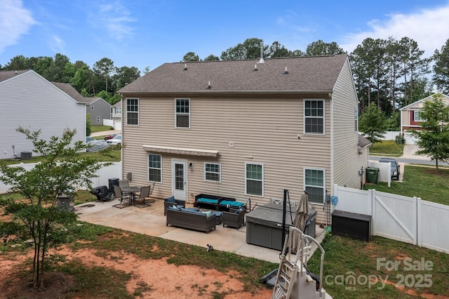 413 Wheat Field Dr, Mount Holly, NC 28120 - back of house with an outdoor hangout area, a patio, a gate, a fenced backyard, and a shingled roof