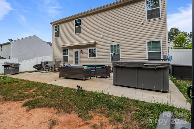 413 Wheat Field Dr, Mount Holly, NC 28120 - rear view of property with outdoor lounge area, a patio area, and a hot tub