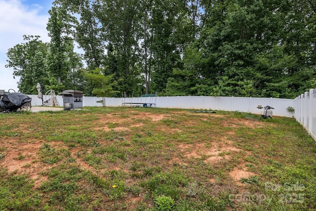 413 Wheat Field Dr, Mount Holly, NC 28120 - view of yard featuring a trampoline