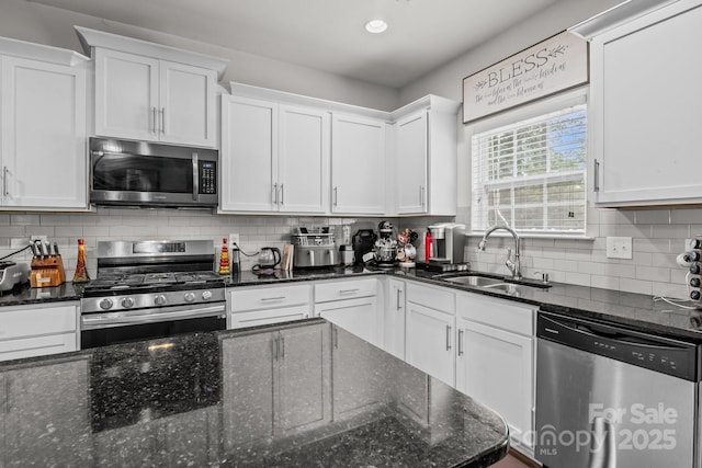 413 Wheat Field Dr, Mount Holly, NC 28120 - kitchen featuring stainless steel appliances, a sink, white cabinetry, and recessed lighting