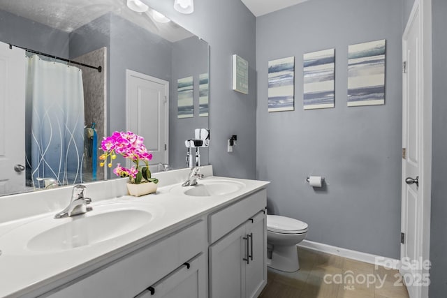 413 Wheat Field Dr, Mount Holly, NC 28120 - bathroom featuring toilet, double vanity, baseboards, and a shower with curtain