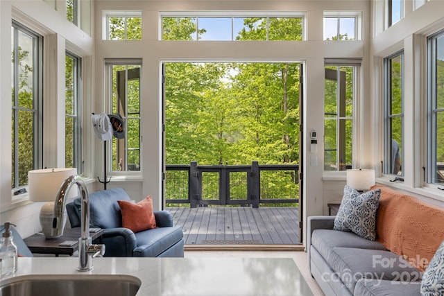 sunroom with a sink