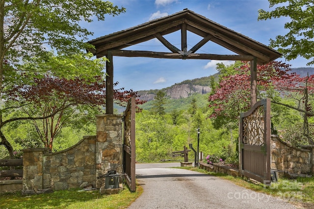 view of dirt / gravel road featuring a mountain view