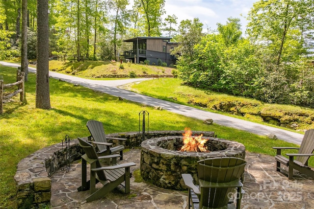view of patio / terrace featuring an outdoor fire pit