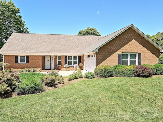 202 Cameron Dr, Kings Mountain, NC 28086 - ranch-style house with brick siding, a garage, a front yard, and a shingled roof