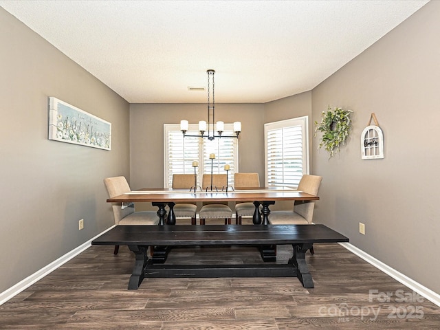 202 Cameron Dr, Kings Mountain, NC 28086 - dining room featuring dark wood-type flooring, healthy amount of natural light, a chandelier, and baseboards