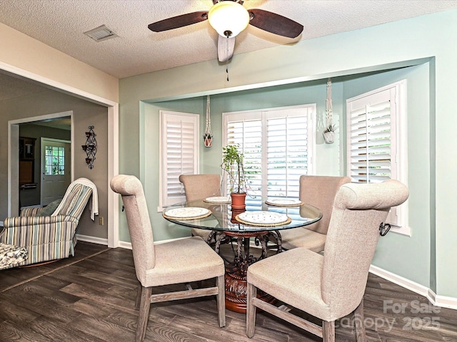 202 Cameron Dr, Kings Mountain, NC 28086 - dining area with wood finished floors, a ceiling fan, a textured ceiling, and baseboards