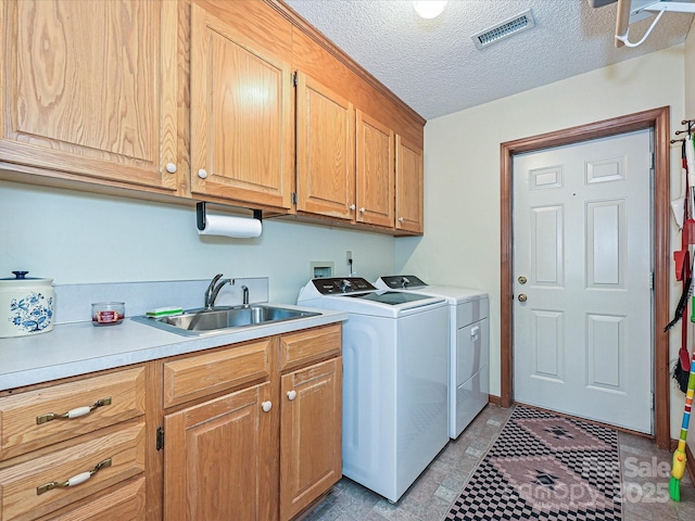 202 Cameron Dr, Kings Mountain, NC 28086 - laundry room featuring cabinet space, independent washer and dryer, and a textured ceiling