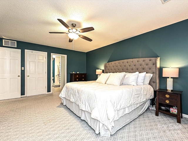 202 Cameron Dr, Kings Mountain, NC 28086 - carpeted bedroom with a textured ceiling, baseboards, a ceiling fan, and ensuite bath
