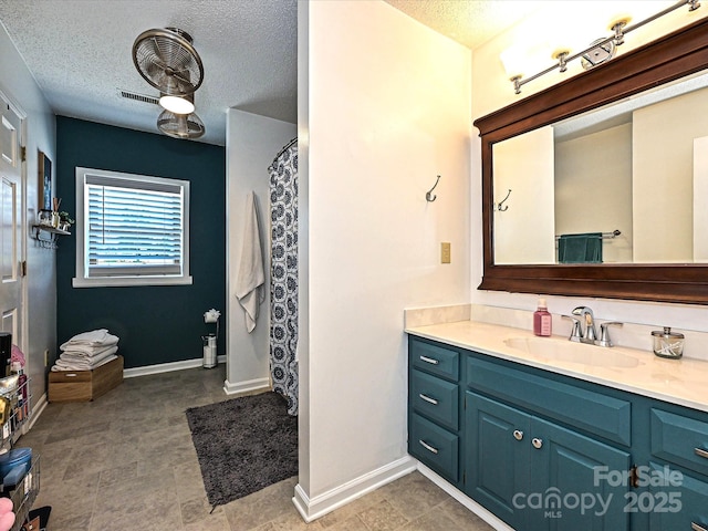 202 Cameron Dr, Kings Mountain, NC 28086 - full bath with vanity, a textured ceiling, baseboards, and curtained shower