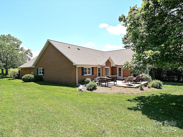 202 Cameron Dr, Kings Mountain, NC 28086 - back of property with a patio, a yard, and brick siding
