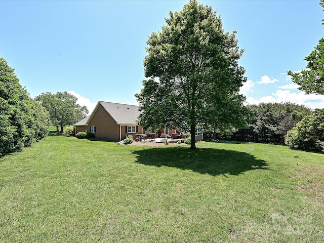 202 Cameron Dr, Kings Mountain, NC 28086 - view of grassy yard featuring a patio area