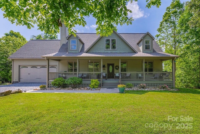 view of front of home with an attached garage, covered porch, gravel driveway, and a front lawn