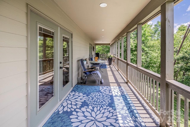 wooden terrace with a porch