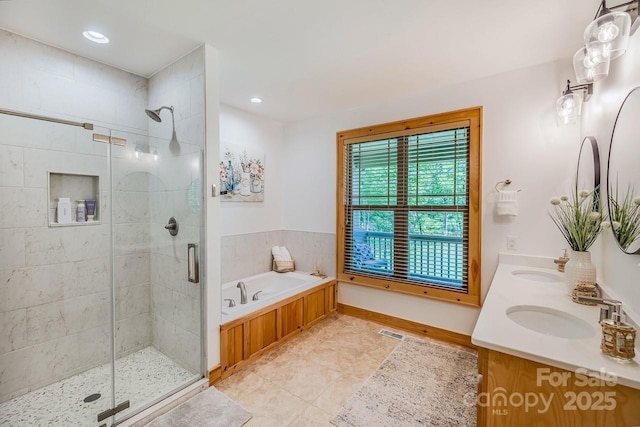 full bath with a shower stall, a garden tub, tile patterned floors, and recessed lighting