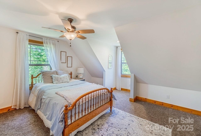 carpeted bedroom featuring baseboards, ceiling fan, and vaulted ceiling